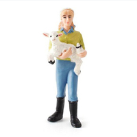 Farmer Holding Baby Lamb Figurine