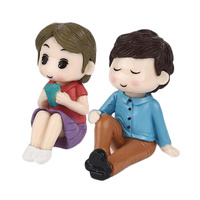 Boy And Girl Sitting Figurine Topper