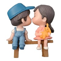 Boy And Girl Seated Figurine Topper 