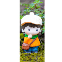 Boy Wearing Orange Jumper Figurine Topper
